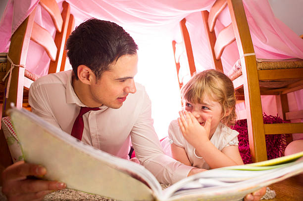 istock father and daughter storytime 510744569
