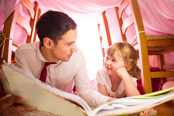 istock father and daughter storytime 510744571