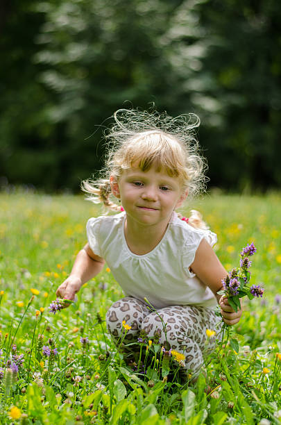 istock blond girl on grass 510762801