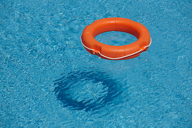 istock Orange life rings in blue water 510763453