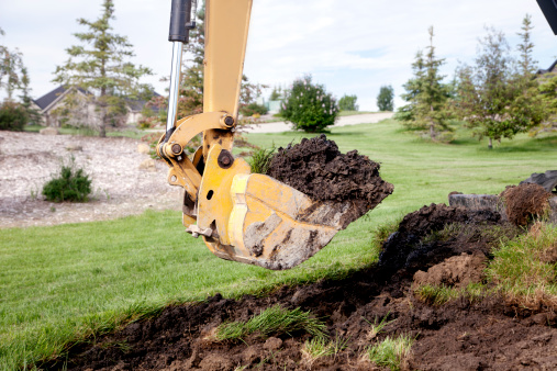 A Backhoe Digging a Trench
