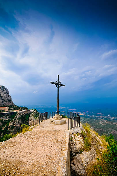 istock Cross on the cliff Montserrat mountain 510764219