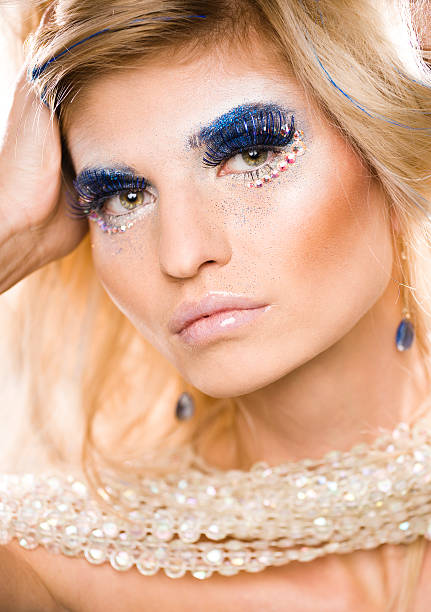 istock beauty blong woman with shiny creative makeup 510769055