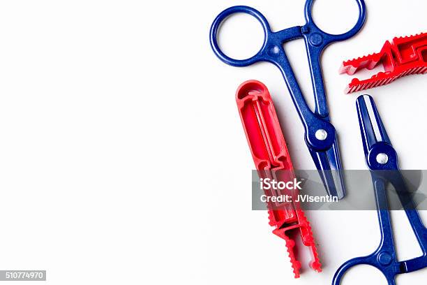Red And Blue Clamps Stock Photo - Download Image Now - Peritoneal Dialysis, Blue, Group Of Objects