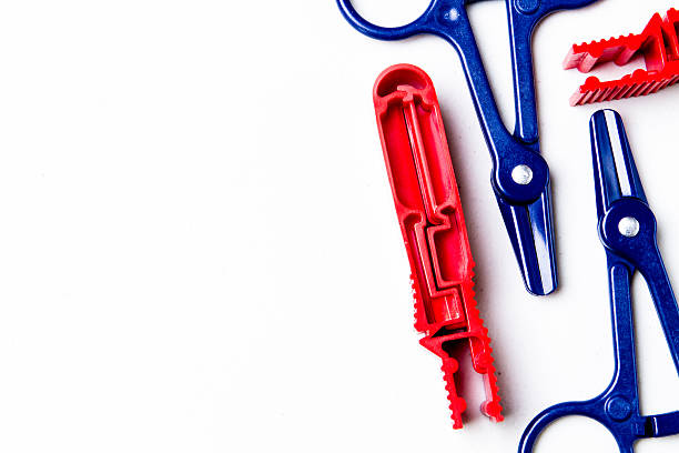 Peritoneal Dialysis Clamps Clamps used in peritoneal dialysis transfers. peritoneal dialysis photos stock pictures, royalty-free photos & images