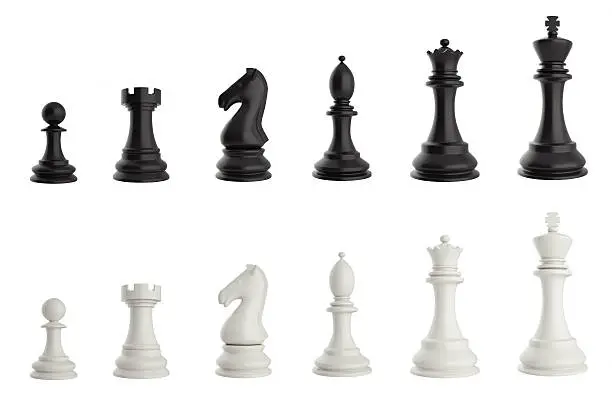 Photo of Set of black and white chess pieces.