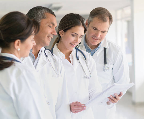 istock Doctors at the hospital looking at some documents 510776898