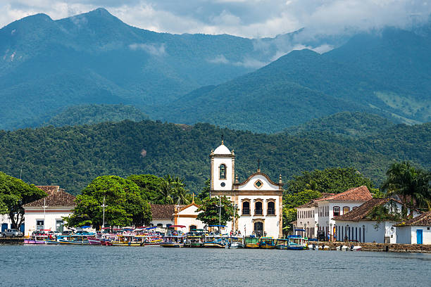 Tourist boats waiting for tourists in Paraty, Brazil Tourist boats waiting for tourists near the Church Igreja de Santa Rita de Cassia in Paraty, state Rio de Janeiro, Brazil paraty brazil stock pictures, royalty-free photos & images