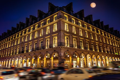 Paris at night and its famous Rivoli boulevard with lights of moonlight