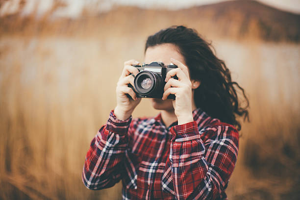 istock young woman taking pictures 510778074
