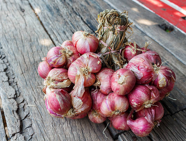 istock Shallots on a wooden 510778122