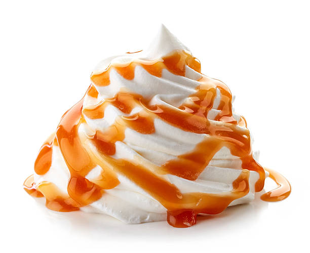istock whipped cream with caramel sauce on white background 510779736