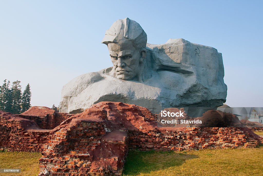 The monument "Courage" Monument to the warrior on the battle flag background Belarus Stock Photo