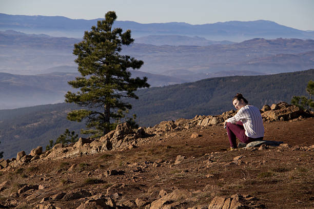 istock Girl Sitting On A Mountain Top 02 510780052