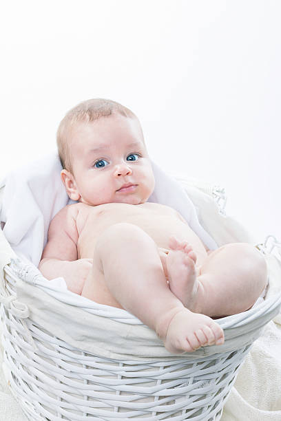 istock Cute baby in white moses basket 510780762