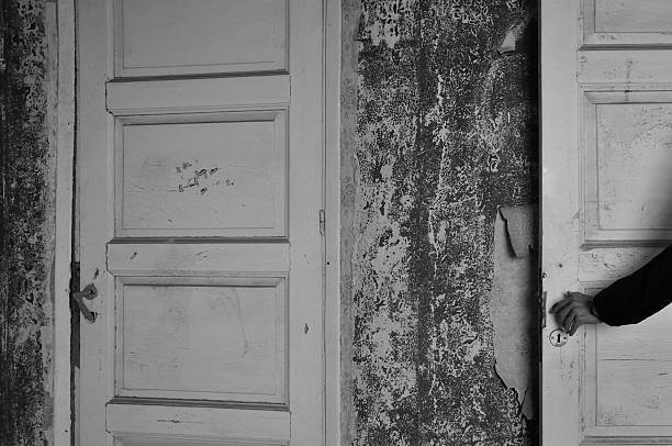 istock doll hand haunted house door 510782440