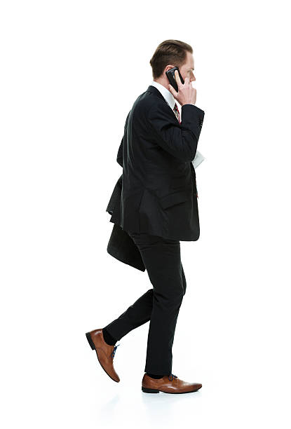 istock Businessman on mobile and walking 510785068