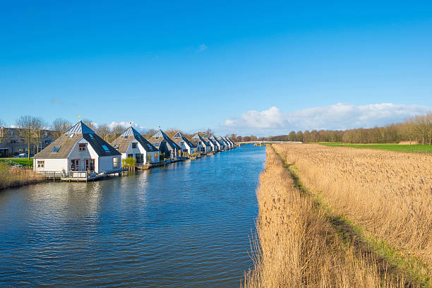 istock Canal through a sunny landscape 510785762