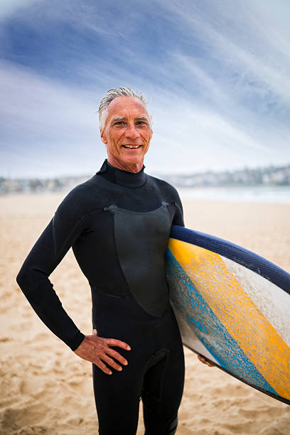 istock Senior Man and Surf Board 510786040
