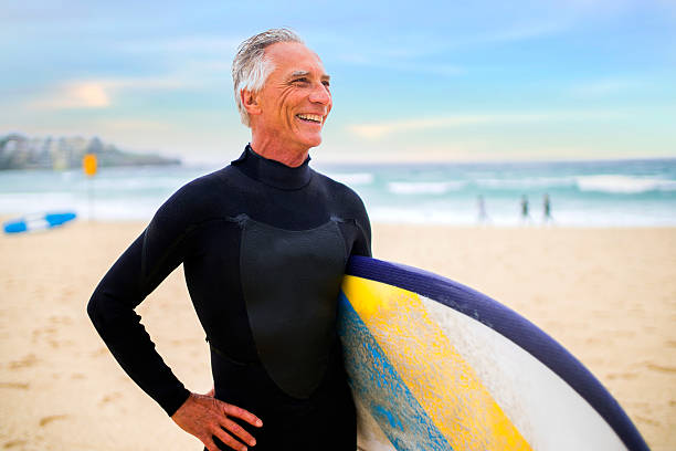istock Senior Man and Surf Board 510786130