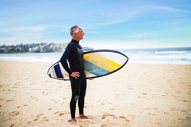 istock Senior Man and Surf Board 510786152