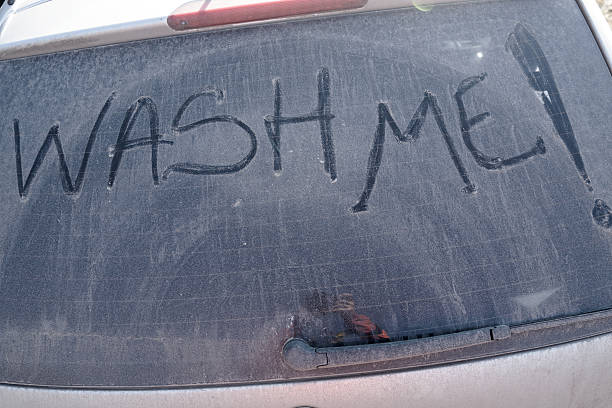 istock Wash me text on dirty windshield 510786162