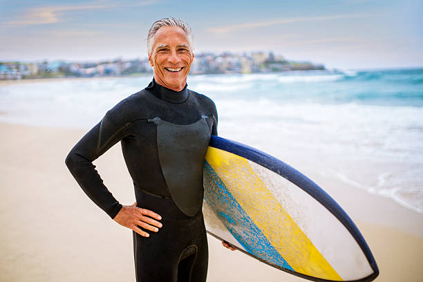 istock Senior Man and Surf Board 510786218