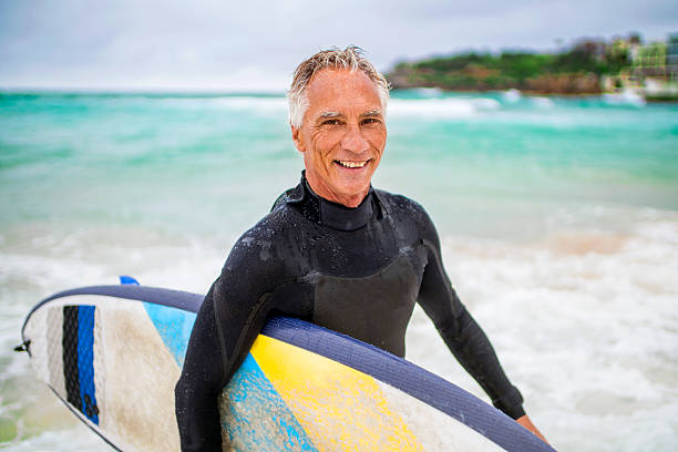 istock Senior Man and Surf Board 510786302