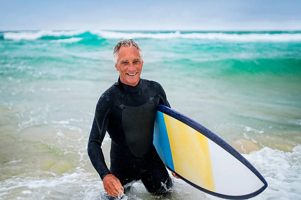 istock Senior Man and Surf Board 510786376