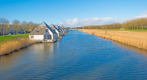 istock Canal through a sunny landscape 510786456