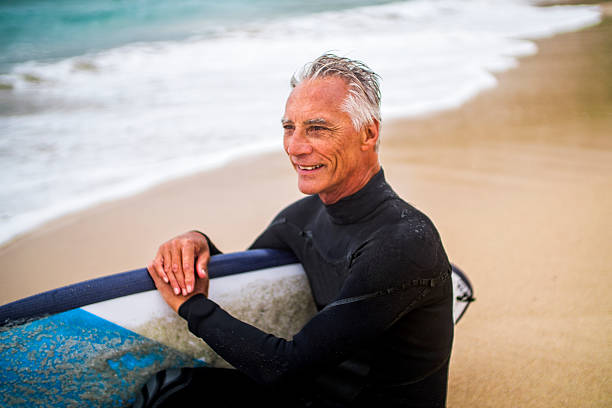 istock Senior Man and Surf Board 510786590