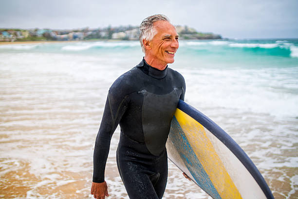 istock Senior Man and Surf Board 510786798