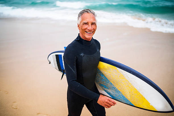 istock Senior Man and Surf Board 510786866