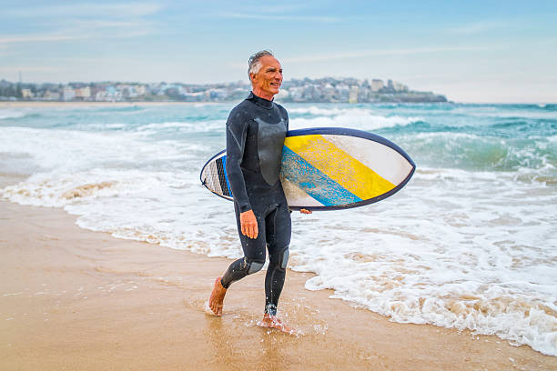 istock Senior Man and Surf Board 510787278