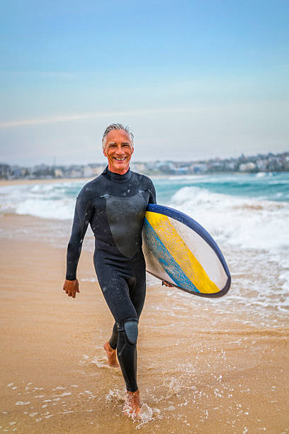 istock Senior Man and Surf Board 510787472