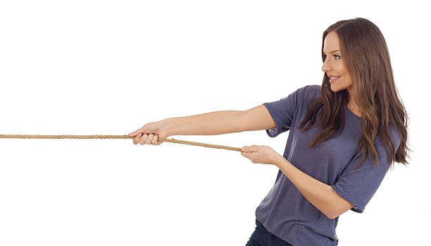 istock Teenager girl pulling a rope 510789448