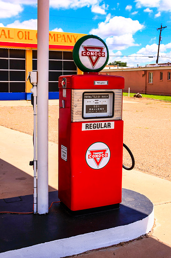 Tucumcari, NM, USA - June 16, 2015:Single restored 50-60s Conoco red gasoline pump on Route 66 in Tucumcari, New Mexico