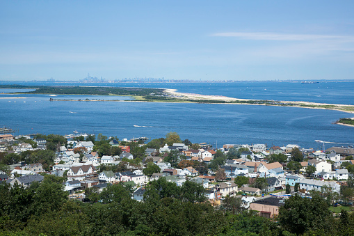 Atlantic Highlands, New Jersey, USA - August 11, 2013: A view from the Twin Lights in the Atlantic Highlands, overlooking the Highlands and Sandy Hook, New Jersey. In the distance, you can see New York City.