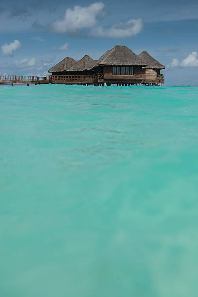istock Luxury Maldives beach over water accommodation indian ocean 510792389