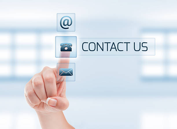 Contact us concept using female hand stock photo