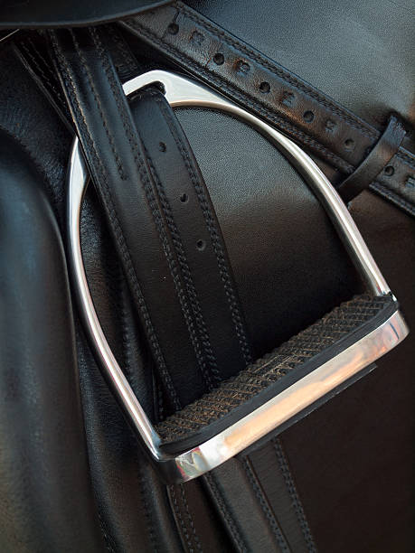 istock stirrup at dressage saddle. close up 510795913