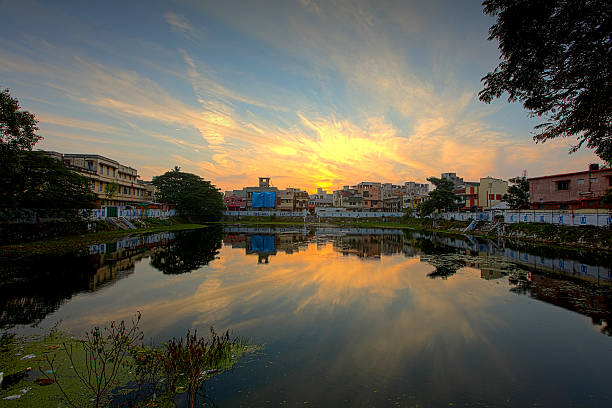 Temple lake in Chennai Temple lake in Chennai with early morning sunrise. chennai photos stock pictures, royalty-free photos & images