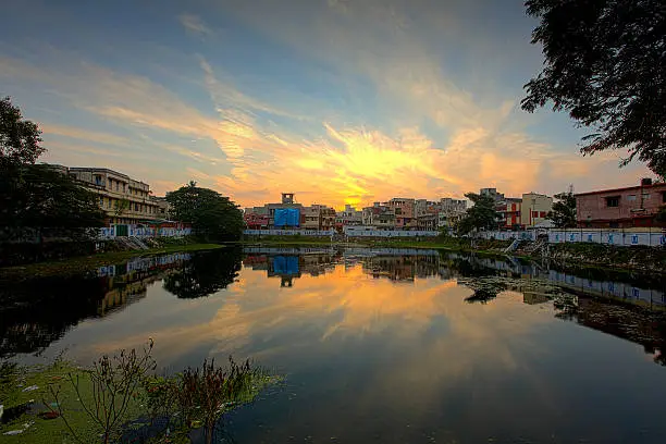 Temple lake in Chennai with early morning sunrise.