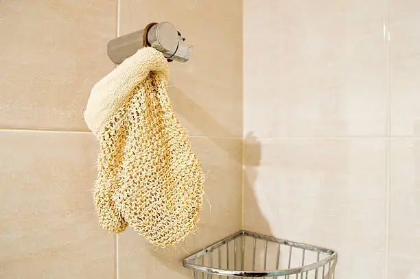 Photo of exfoliating mitt in the shower