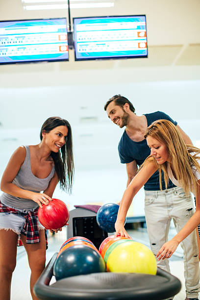 istock Three Friends Bowling Together. 510796656