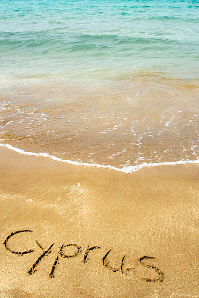 istock Cyprus written in sand on beach 510797375