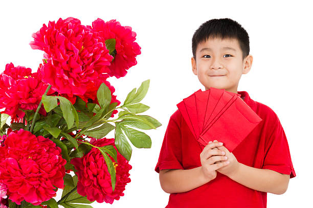 istock Asian Little Boy Holding a Red Envelope 510797732