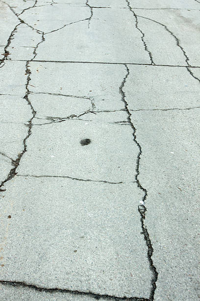 istock Paved road with holes as a background 510797757