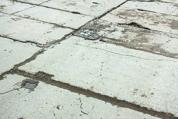 istock Paved road with holes as a background 510797759