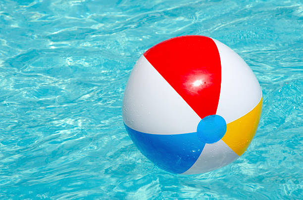 istock Colourful beach ball floating in the pool. 510798329